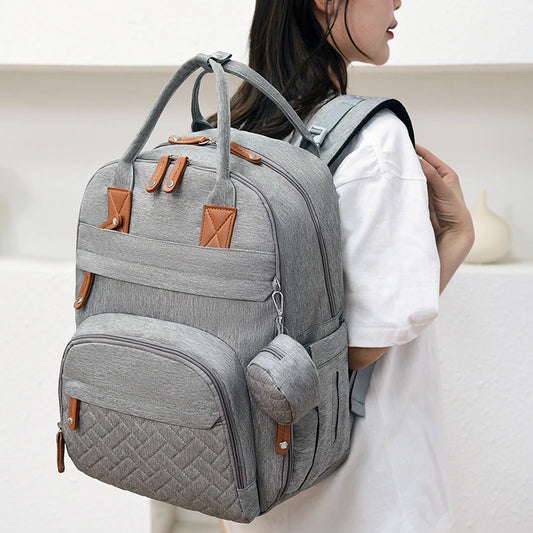 LumiNest™ Premium Diaper Backpack featuring three insulated bottle compartments